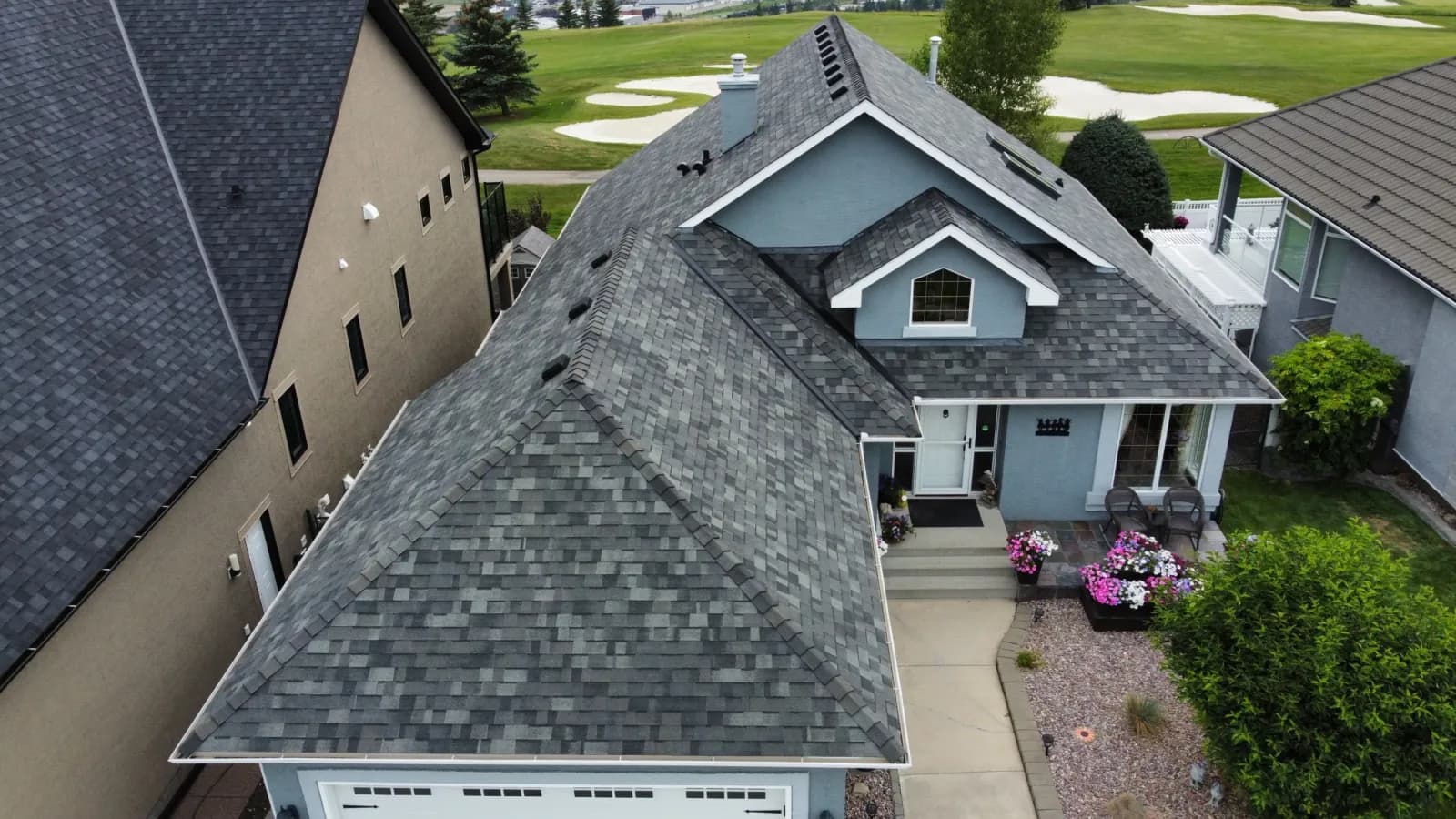 Residential roof replacement in Cochrane by Red Seal Journeyman owned Sure West