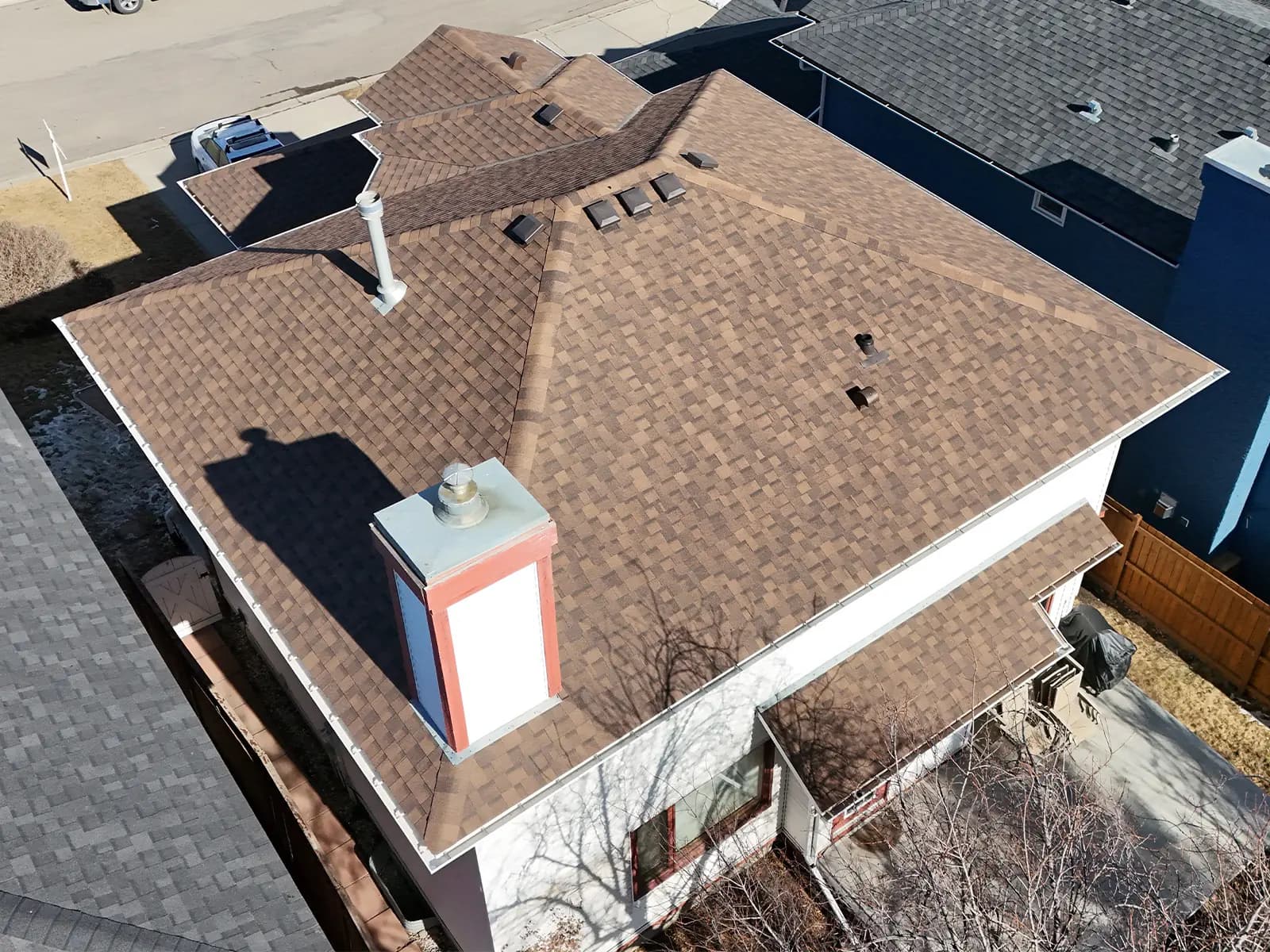 Hail-damaged shingle replacement on a Cochrane Alberta home