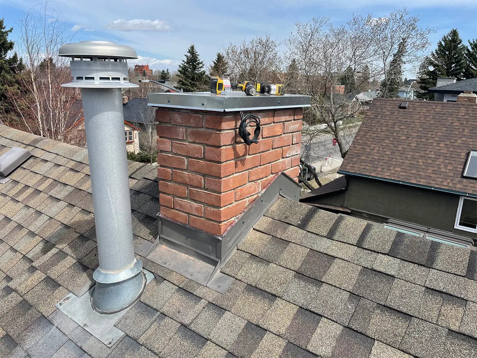Roof flashing rebuild around a chimney in Cochrane Alberta