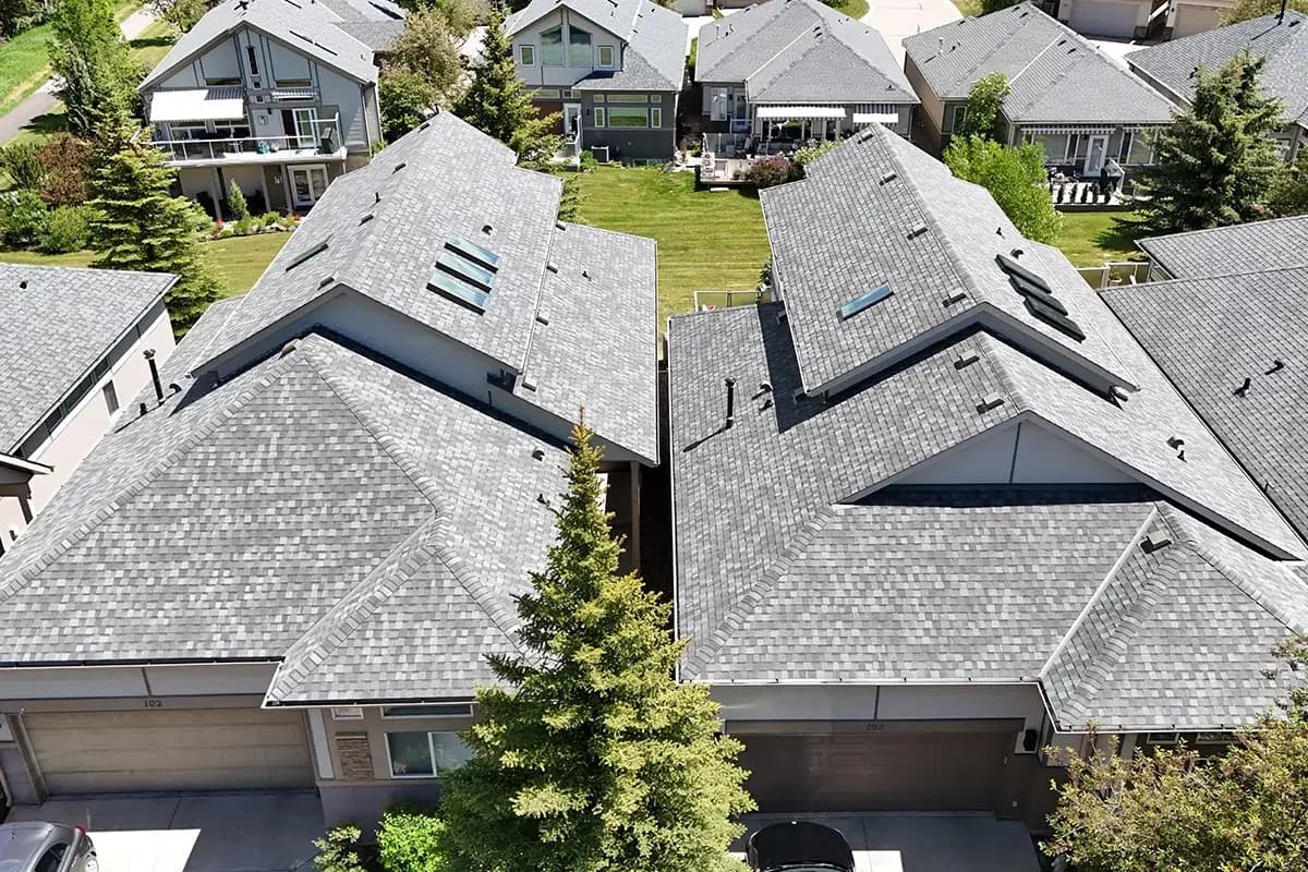 Sure West Roofing Red Seal Journeyman completing a roof repair in Cochrane Alberta