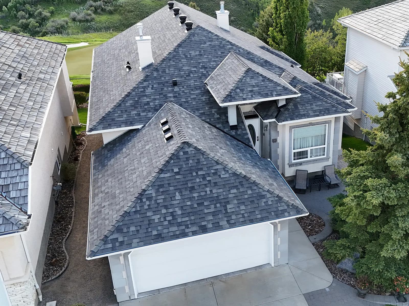 Impact-resistant shingle roof in Cochrane by Sure West Roofing
