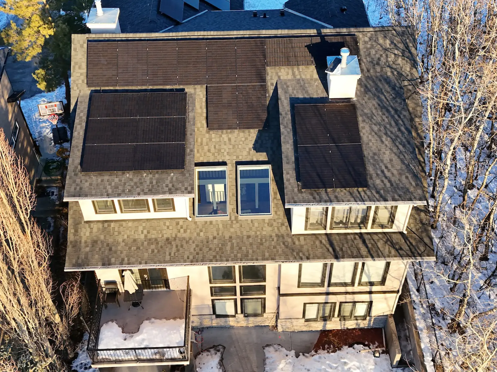 Aerial view of a two-storey Cochrane Alberta home with skylights set into the roof