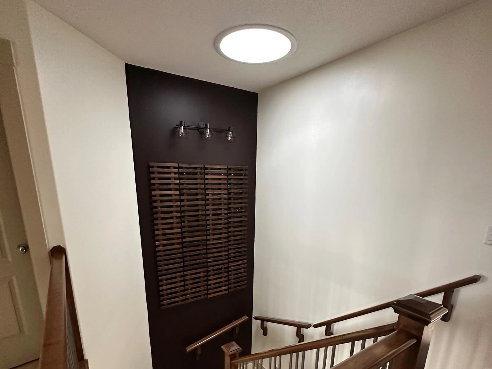 Interior view of a tubular skylight diffuser in a Cochrane Alberta home